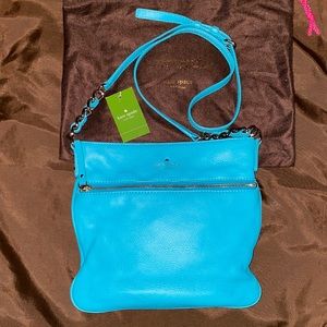 Turquoise blue cross body purse.